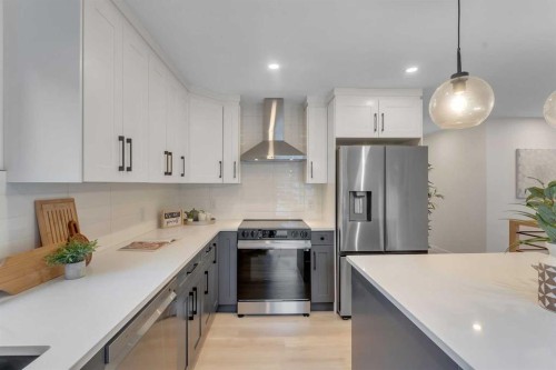 104 Oakmoor Place Sw, Calgary, AB - Indoor Photo Showing Kitchen With Stainless Steel Kitchen With Upgraded Kitchen