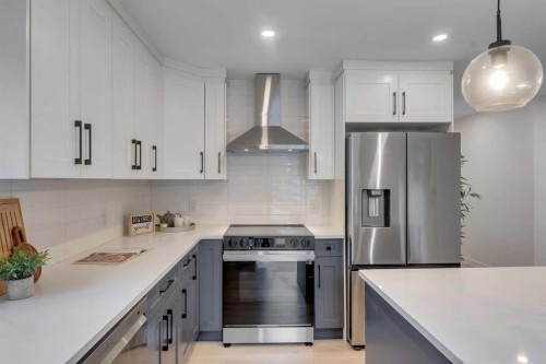 104 Oakmoor Place Sw, Calgary, AB - Indoor Photo Showing Kitchen With Stainless Steel Kitchen With Upgraded Kitchen