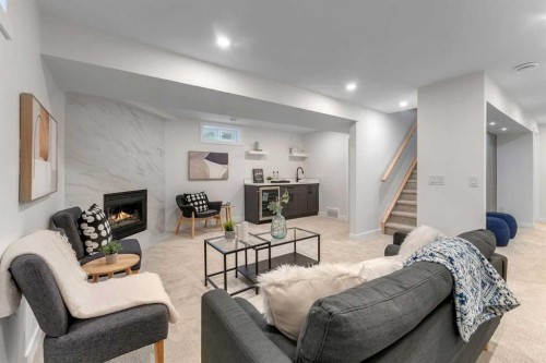 104 Oakmoor Place Sw, Calgary, AB - Indoor Photo Showing Living Room With Fireplace