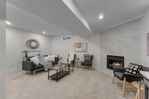 104 Oakmoor Place Sw, Calgary, AB - Indoor With Fireplace