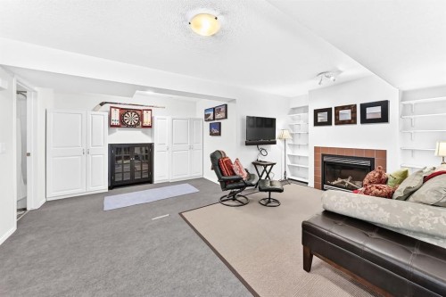 331 Royal Birch View Nw, Calgary, AB - Indoor Photo Showing Living Room With Fireplace