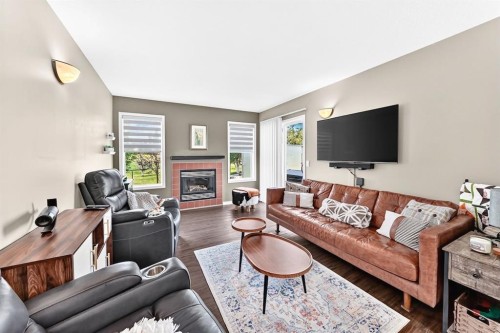 331 Royal Birch View Nw, Calgary, AB - Indoor Photo Showing Living Room With Fireplace
