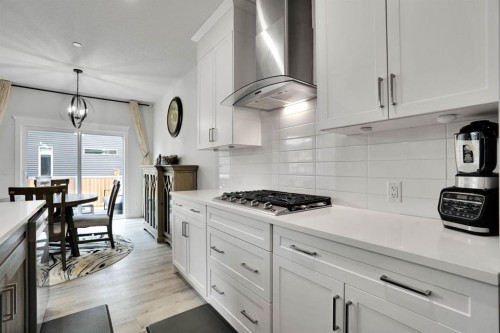 159 Hotchkiss Manor Se, Calgary, AB - Indoor Photo Showing Kitchen With Upgraded Kitchen