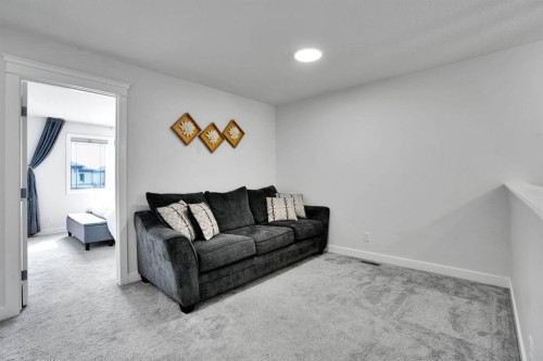 159 Hotchkiss Manor Se, Calgary, AB - Indoor Photo Showing Living Room
