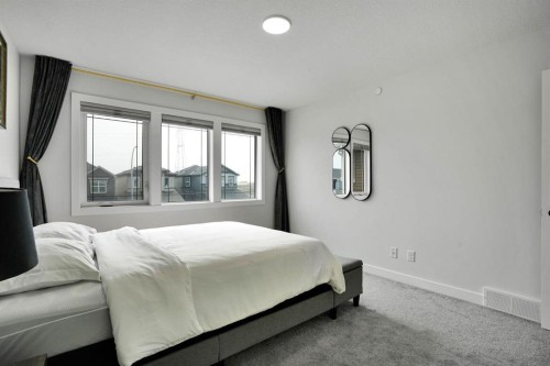 159 Hotchkiss Manor Se, Calgary, AB - Indoor Photo Showing Bedroom