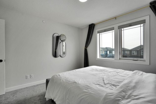 159 Hotchkiss Manor Se, Calgary, AB - Indoor Photo Showing Bedroom
