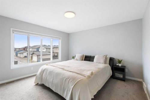 28 Seton Terrace Se, Calgary, AB - Indoor Photo Showing Bedroom