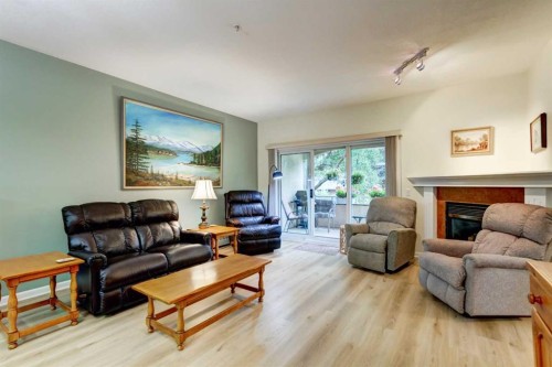 109-43 Westlake Circle, Strathmore, AB - Indoor Photo Showing Living Room With Fireplace