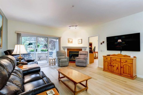 109-43 Westlake Circle, Strathmore, AB - Indoor Photo Showing Living Room With Fireplace