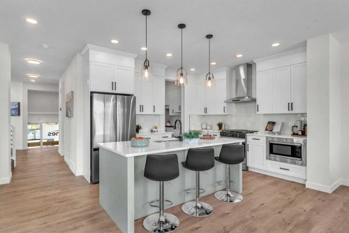 319 Kinniburgh Loop, Chestermere, AB - Indoor Photo Showing Kitchen With Stainless Steel Kitchen With Upgraded Kitchen