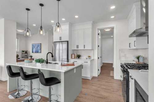 319 Kinniburgh Loop, Chestermere, AB - Indoor Photo Showing Kitchen With Upgraded Kitchen