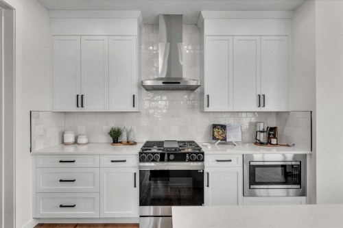 319 Kinniburgh Loop, Chestermere, AB - Indoor Photo Showing Kitchen With Upgraded Kitchen