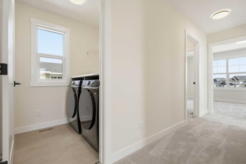 319 Kinniburgh Loop, Chestermere, AB - Indoor Photo Showing Laundry Room