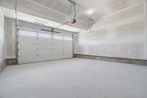 319 Kinniburgh Loop, Chestermere, AB - Indoor Photo Showing Garage