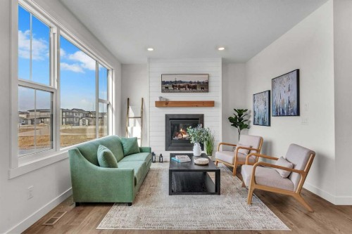 319 Kinniburgh Loop, Chestermere, AB - Indoor Photo Showing Living Room With Fireplace