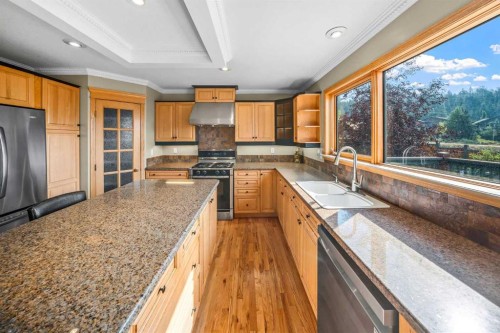 1 Eagle Landing, Canmore, AB - Indoor Photo Showing Kitchen With Double Sink