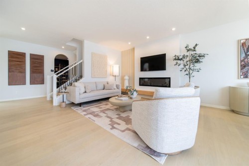 341 West Grove Lane Sw, Calgary, AB - Indoor Photo Showing Living Room With Fireplace