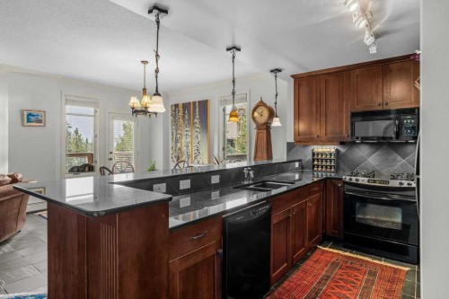 202-140 Stonecreek Road, Canmore, AB - Indoor Photo Showing Kitchen