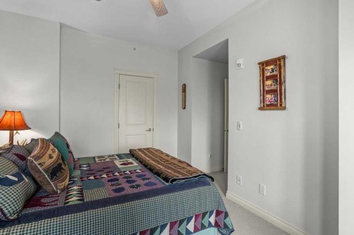 202-140 Stonecreek Road, Canmore, AB - Indoor Photo Showing Bedroom