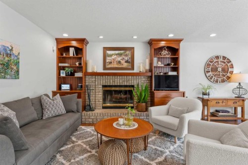 116 Sun Harbour Way Se, Calgary, AB - Indoor Photo Showing Living Room With Fireplace
