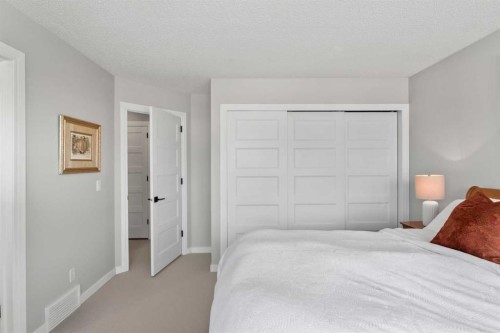 116 Sun Harbour Way Se, Calgary, AB - Indoor Photo Showing Bedroom