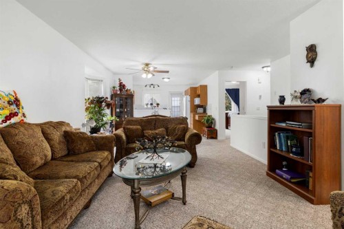 100 Dovista Court Se, Calgary, AB - Indoor Photo Showing Living Room