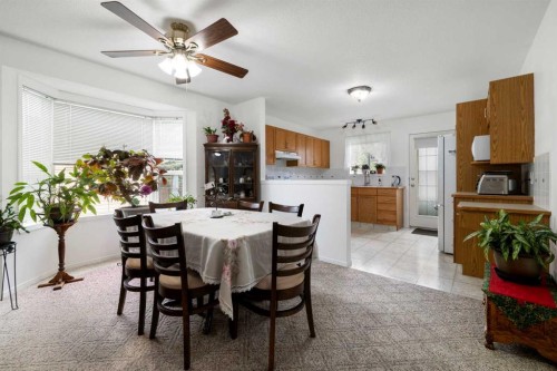 100 Dovista Court Se, Calgary, AB - Indoor Photo Showing Dining Room