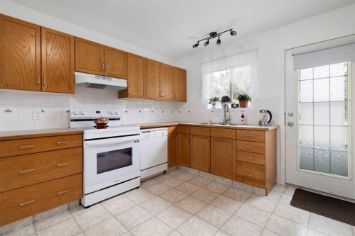 100 Dovista Court Se, Calgary, AB - Indoor Photo Showing Kitchen