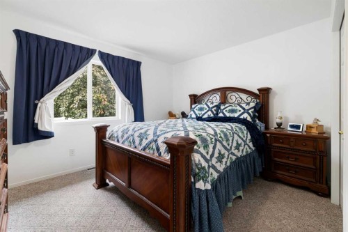 100 Dovista Court Se, Calgary, AB - Indoor Photo Showing Bedroom