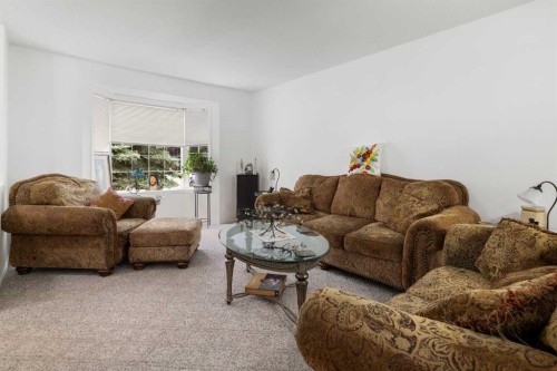 100 Dovista Court Se, Calgary, AB - Indoor Photo Showing Living Room