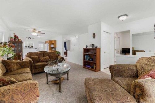 100 Dovista Court Se, Calgary, AB - Indoor Photo Showing Living Room