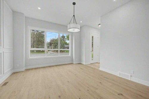 8310 34 Avenue Nw, Calgary, AB - Indoor Photo Showing Other Room With Fireplace