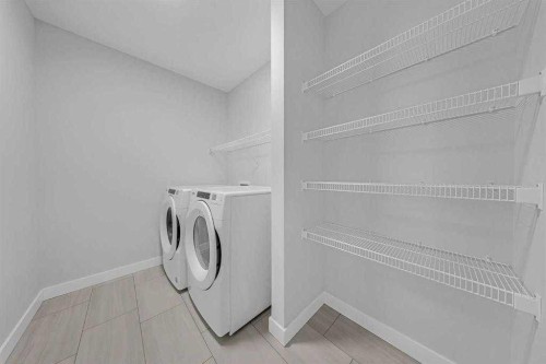 82 Belvedere Green Se, Calgary, AB - Indoor Photo Showing Laundry Room