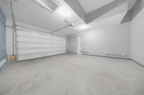 82 Belvedere Green Se, Calgary, AB - Indoor Photo Showing Garage