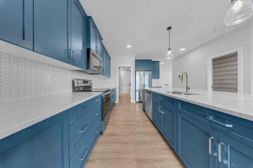 82 Belvedere Green Se, Calgary, AB - Indoor Photo Showing Kitchen With Double Sink With Upgraded Kitchen