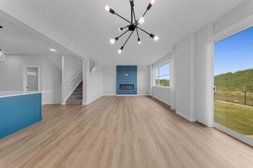 82 Belvedere Green Se, Calgary, AB - Indoor With Fireplace