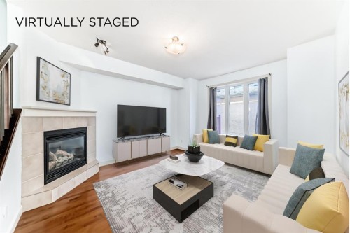 2-1921 30 Street Sw, Calgary, AB - Indoor Photo Showing Living Room With Fireplace
