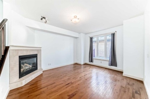 2-1921 30 Street Sw, Calgary, AB - Indoor With Fireplace