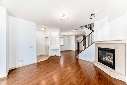 2-1921 30 Street Sw, Calgary, AB - Indoor Photo Showing Living Room With Fireplace