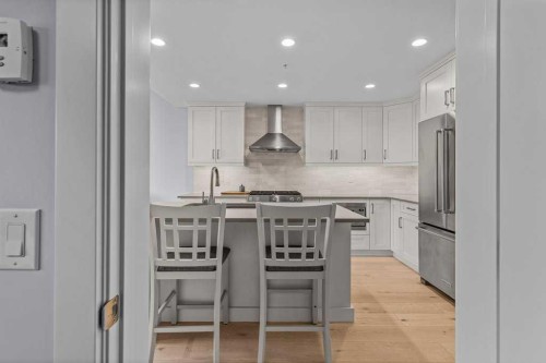 409-1105 Spring Creek Drive, Canmore, AB - Indoor Photo Showing Kitchen With Stainless Steel Kitchen With Upgraded Kitchen