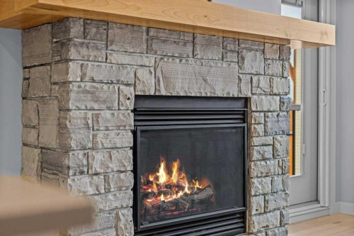 409-1105 Spring Creek Drive, Canmore, AB - Indoor With Fireplace