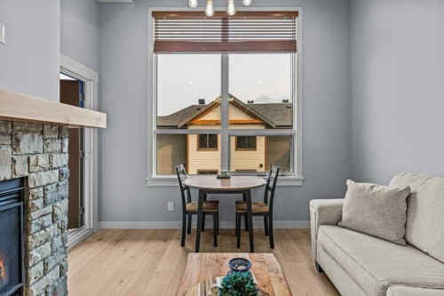 409-1105 Spring Creek Drive, Canmore, AB - Indoor With Fireplace