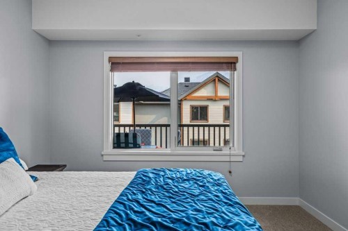 409-1105 Spring Creek Drive, Canmore, AB - Indoor Photo Showing Bedroom