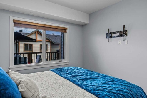 409-1105 Spring Creek Drive, Canmore, AB - Indoor Photo Showing Bedroom