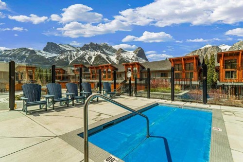 409-1105 Spring Creek Drive, Canmore, AB - Outdoor With In Ground Pool