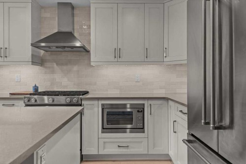 409-1105 Spring Creek Drive, Canmore, AB - Indoor Photo Showing Kitchen With Stainless Steel Kitchen With Upgraded Kitchen