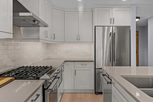 409-1105 Spring Creek Drive, Canmore, AB - Indoor Photo Showing Kitchen With Stainless Steel Kitchen With Upgraded Kitchen