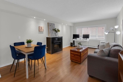 204-728 3 Avenue Nw, Calgary, AB - Indoor With Fireplace