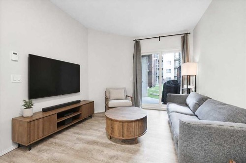 1108-73 Erin Woods Court Se, Calgary, AB - Indoor Photo Showing Living Room