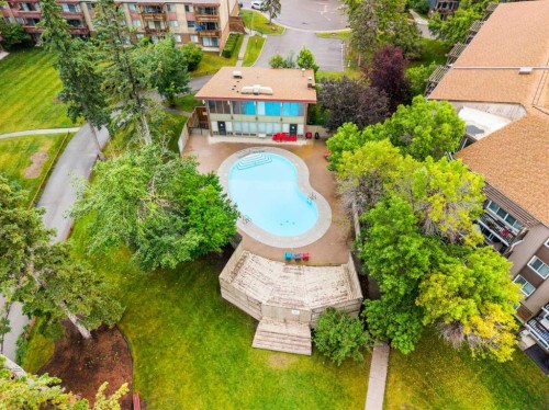 607-8948 Elbow Drive Sw, Calgary, AB - Outdoor With In Ground Pool